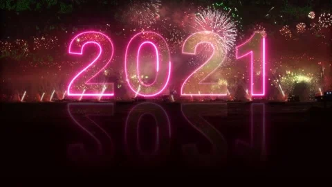 2021 is reflected in the water. colorful exploding fireworks. 4K video Stock Footage 143499194