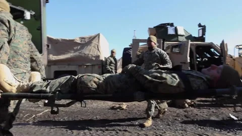 2021 U.S. Marines practice evacuating wounded soldiers, loading them onto Video stock 152617550