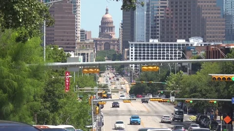2021 - View traffic down Congress Street in Austin, Texas with Capitol Building Stock Footage 160332508