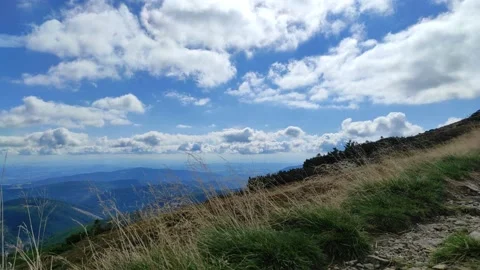 2022-09-23 beautiful view of mountains and sky with clouds. helicopter lifts  Stock Footage 214849969