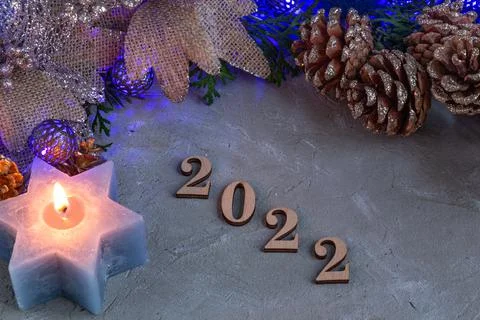 2022, new year composition in silver blue color, blue garland, spruce, candle Stock Photos
