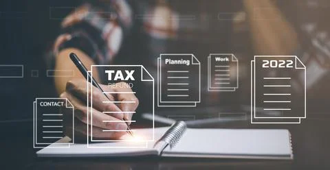 2022 plan concept Man Hand pen using book notes with bar TAX REFUND and refun Stock Photos