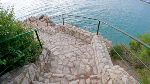 2022 Walking Down The Stairs Platja dels Capellans Vela de Salou Tarragona Spain Stock Footage 220162762