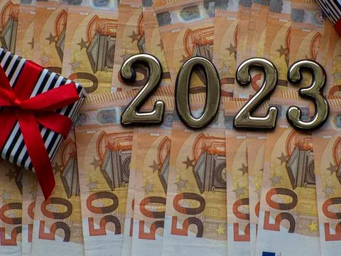 2023 and gift box on the background of fifty euros banknotes Stock Photos