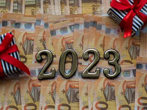 2023 and gift boxes on the background of fifty euros banknotes Stock Photos