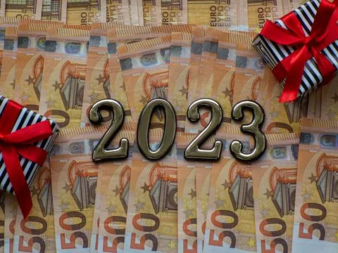 2023 and gift boxes on the background of fifty euros banknotes Stock Photos