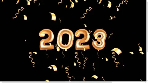 2023 foil balloons with confetti on black background Stock Footage 219244307