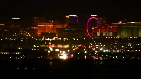 2023 Las Vegas Strip in background, U.S. Airforce fighter jets night time take Stock Footage 246040862