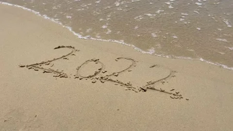 2023 numbers on sandy beach Happy New Year 2023, number hand written. Numbers Stock Footage 202147279