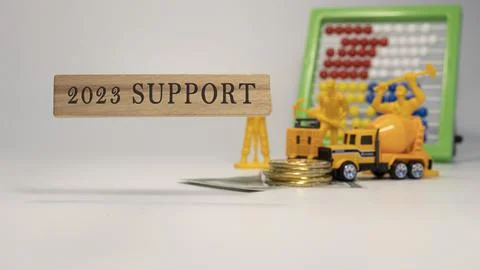 2023 SUPPORT text. It was taken in the studio written on a wooden frame. whit Stock Photos