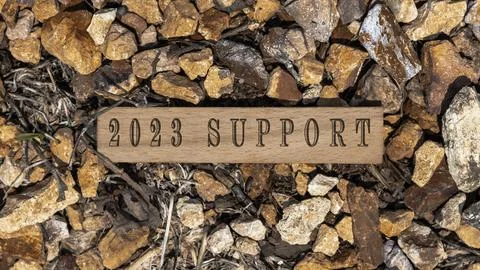 2023 SUPPORT text. It was taken in the studio written on a wooden frame. wh.. Stock Photos
