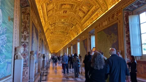 2023 - Tourists explore a hall in the Sistine Chapel where the walls and ceiling Stock Footage 241593645