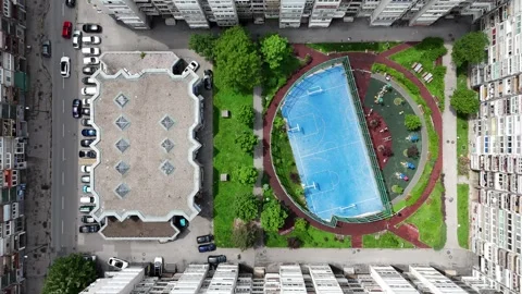 2024-05-15 Top-down ascending footage of Sarajevo residential area sports park a Stock Footage 295607343