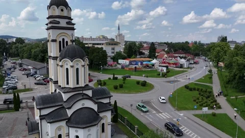 2024-05-27 Reverse aerial of Banja Luka mosque, church, and Vrbas River view Stock Footage 295045087
