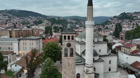 2024-06-22 Reverse Aerial footage starting at Sarajevo Clocktower clock hands Stock Footage 295039738