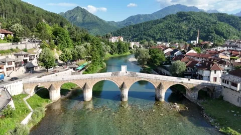 2024-06-28 Forward and downward-moving aerial footage of Konjic Old Bridge Stock Footage 294951029