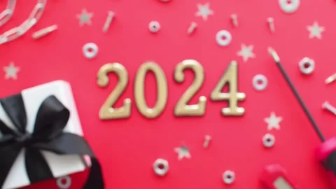 2024 and construction tools and wrapped gift on red background Stock Footage 251651829