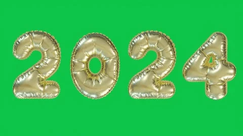 2024 New Year inflating balloon with green background with gold numbers Stock Footage 256024951