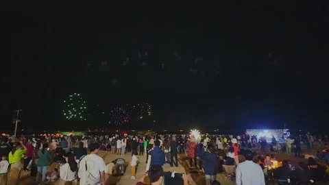 2024 Oct 4. Shanghai, Large crowd watching multicolored firework display at Stock Footage 333244333