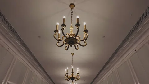 2024 Oct 6. Shanghai, Low angle of gilded Rococo chandelier in hall Stock Footage 333495902