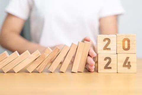 2024 year with falling blocks on table, Risk Management, recession, busines.. Stock Photos