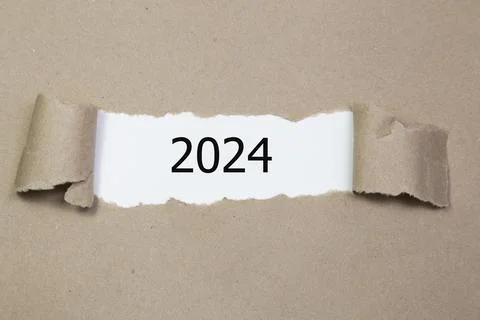 2024 year inside of brown torn paper Stock Photos