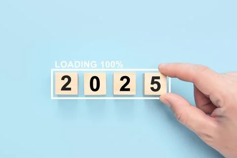 2025 New Year Loading. Loading bar with wooden blocks 2025 on blue background Stock Photos