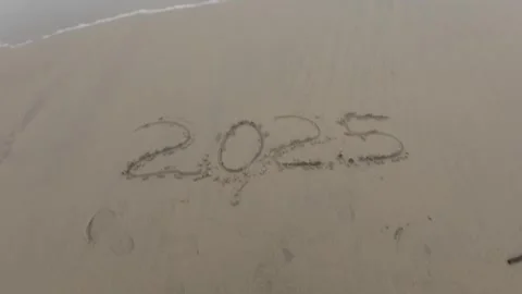 2025 Written Text On Beach Wet Yellow Sand Stock Footage 280567248