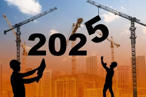 2025 year concept. Construction worker and crane on the backdrop of sunset and Stock Photos