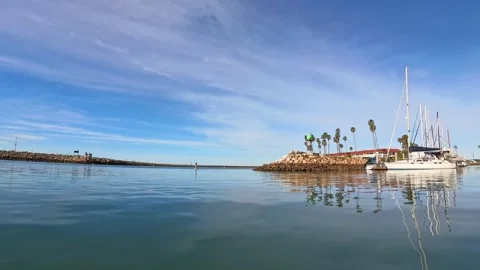 2026-03-01 Oceanside, CA Harbor marina center facing harbor entrance and jetty Stock Footage 331615866