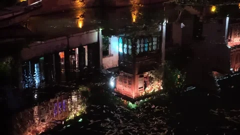 2026 Aug 01, Jiaxing. Distorted rippled reflections of illuminated traditional Stock Footage 344793301