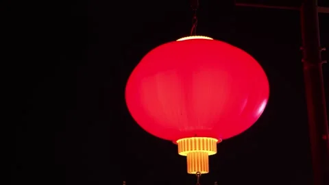 2026 Aug 01, Jiaxing. Large glowing red Chinese lanterns glow against dark Stock Footage 344791077