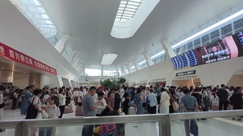 2026 Aug 02, Jiaxing. Crowd of passengers queuing and waiting Stock Footage 344799340