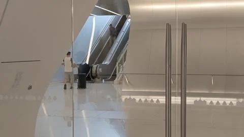 2026 Aug 02, Jiaxing. Three men moving through bright modern transit space Stock Footage 344798674