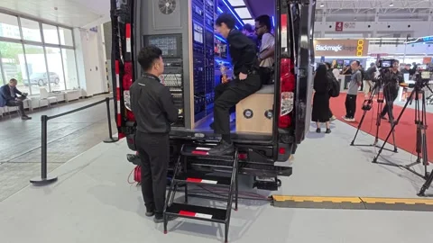 2026 Aug 20, Beijing. BIRTV Technicians work on broadcasting equipment Stock Footage 344810694
