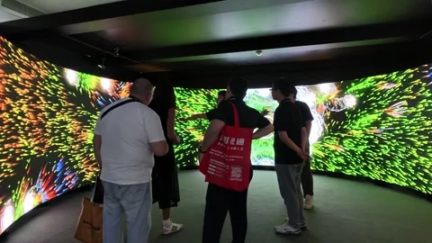 2026 Aug 20, Beijing. BIRTV Visitors observe vibrant colorful immersive art Video stock 344810770