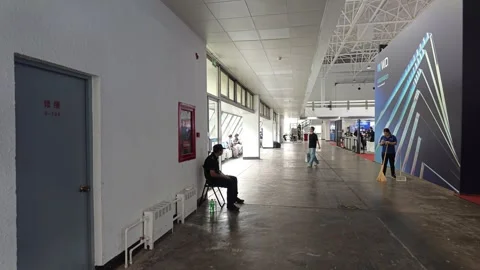 2026 Aug 20, Beijing. BIRTV Security guard and cleaner wait Stock Footage 344810846
