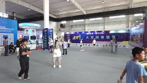 2026 Aug 20, Beijing. BIRTV Attendees explore large immersive XR tech exhibition Video stock 344835119