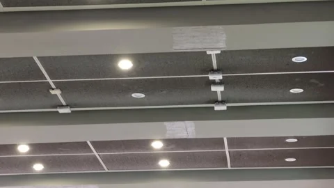 2026 Aug 23, Shanghai. Low-angle pan across modern drop ceiling Stock Footage 344842855