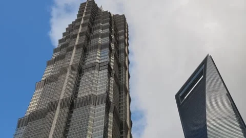 2026 Aug 27, Shanghai. Dramatic low angle upward view of two modern towering Stock Footage 344848165