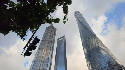2026 Aug 27, Shanghai. Dramatic low angle view of three towering glass Vidéo 344852746
