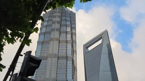 2026 Aug 27, Shanghai. Low angle upward view of two iconic modern glass Stock Footage 344852792