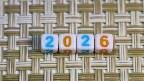 2026 colorful text on cubes arranged on a mat, Concept of 2026 New Year arr.. Video stock 320982457