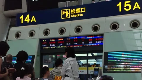 2026 Jul 03, Hangzhou. train station Passengers with kids queue orderly Stock Footage 338426690