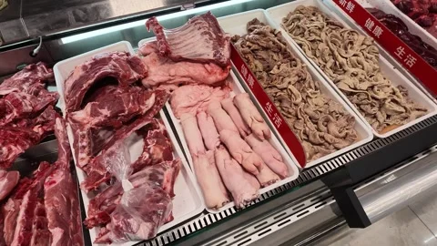 2026 Jul 04. Customer Hand Points at Raw Meat Trays in Supermarket Display Case Видео 339085872