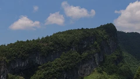 2026 Jul 15, Wulong. Tiny Viewing Platform Figures Overlook Forested Cliff Stock Footage 340523462