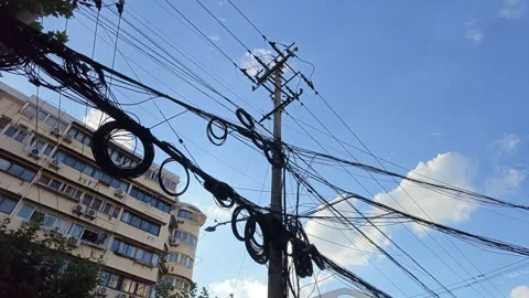 2026 Jul 25, Shanghai. Low-angle view of chaotic tangled overhead cables Stock Footage 344740979
