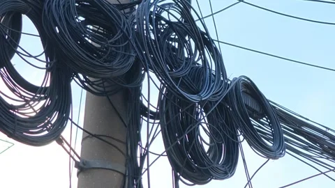 2026 Jul 25, Shanghai. Low angle close-up of tangled black cables wrapped Stock Footage 344741044