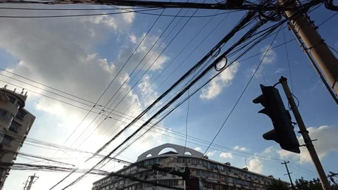2026 Jul 25, Shanghai. Low angle view of dense tangled utility wires against Stock Footage 344741087
