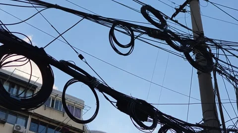 2026 Jul 25, Shanghai. Tangled overhead telecommunication cables against Stock Footage 344741012